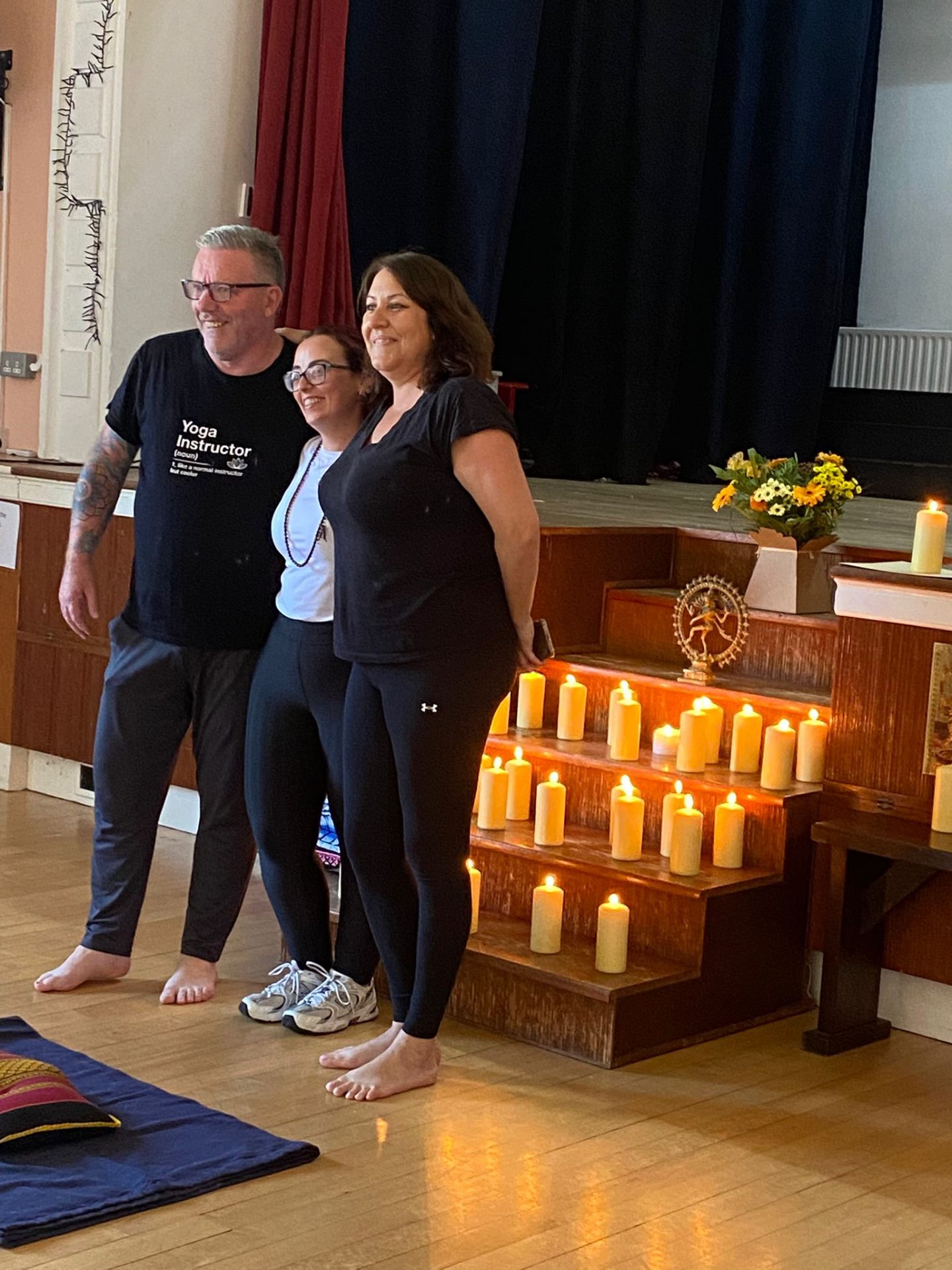 A graduate with Michael and Mary after receiving her certificate